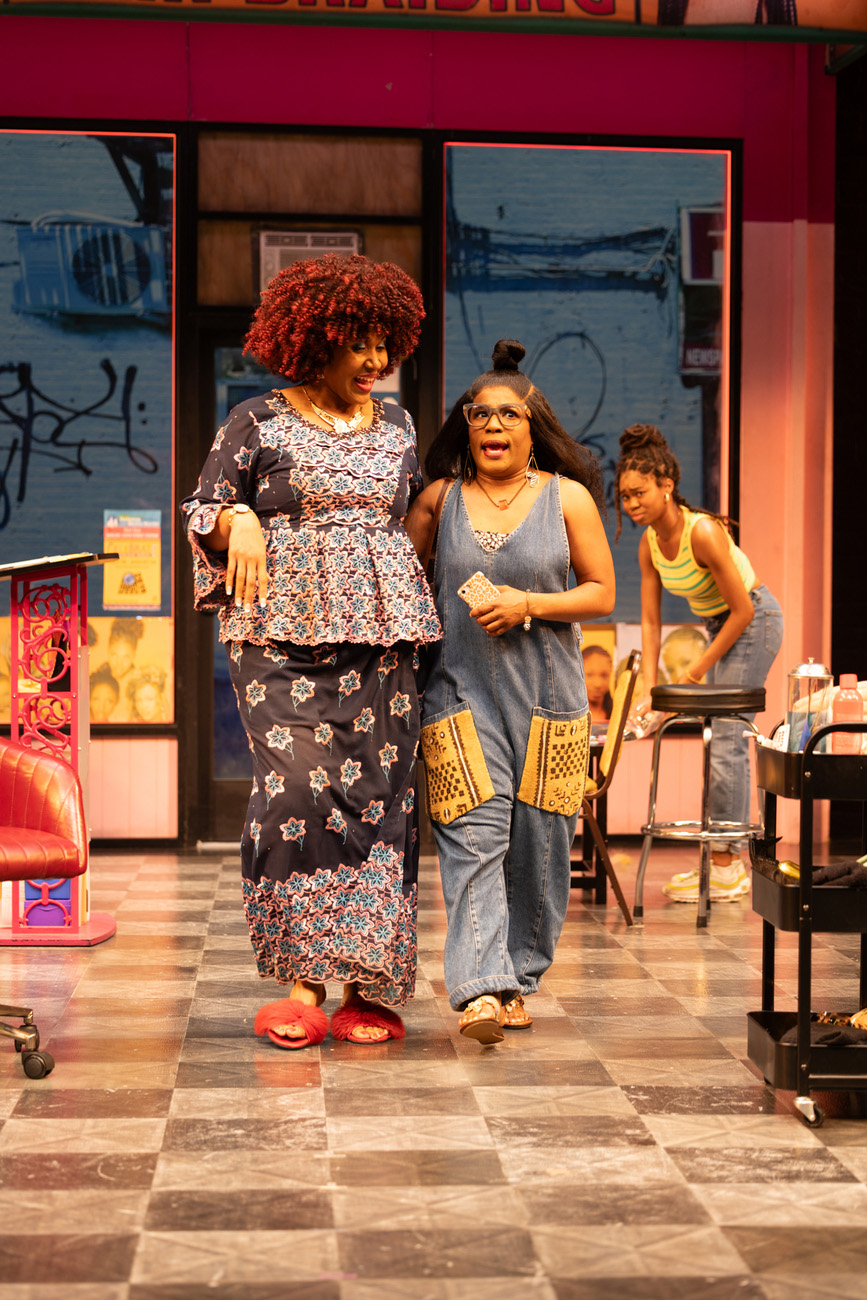 Claudia Logan (left) and Melanie Brezill in La Jolla Playhouse’s production of Jaja’s African Hair Braiding; photo by Rich Soublet II.