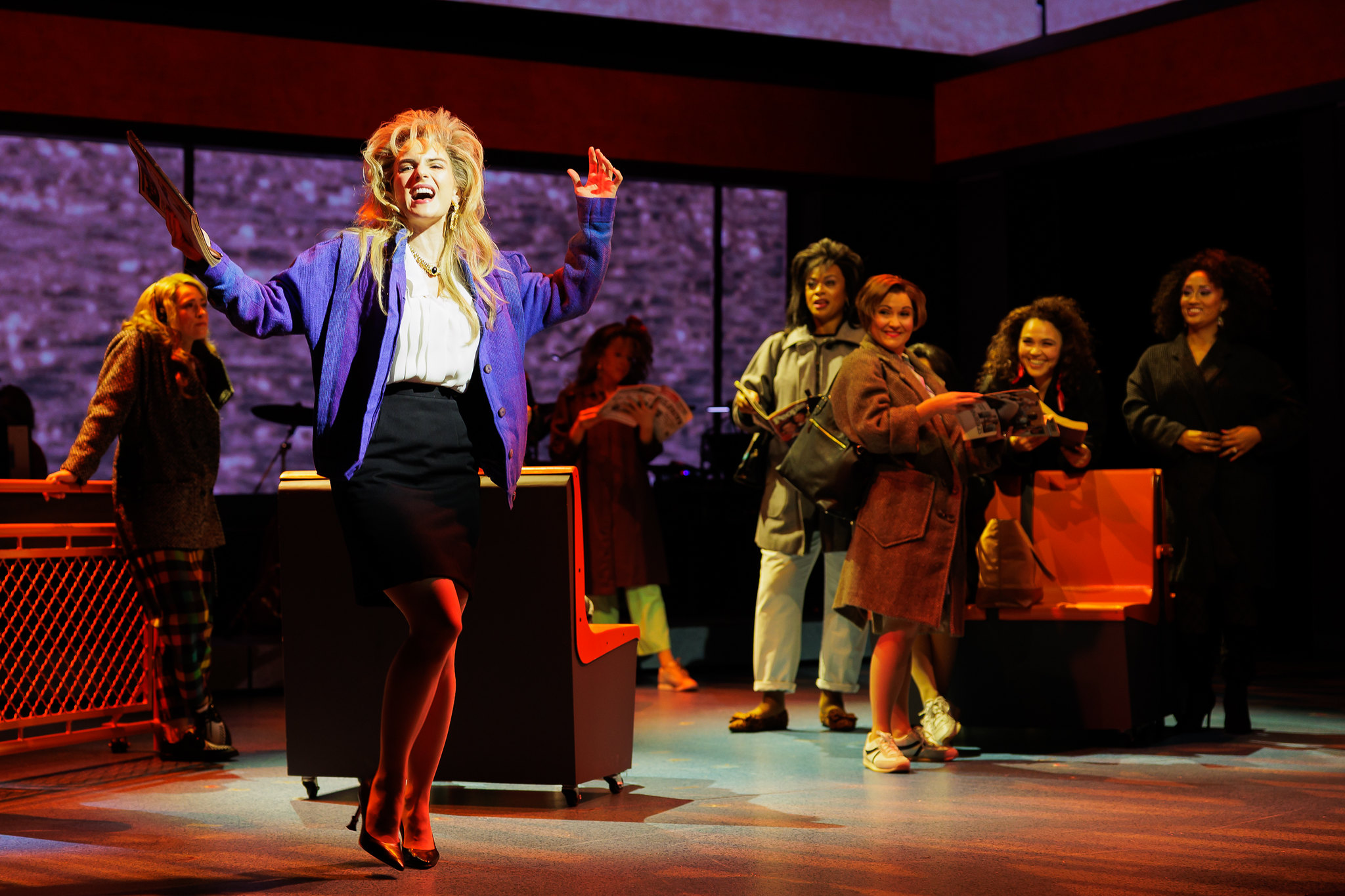 Joanna “JoJo” Levesque (left) with cast members in WORKING GIRL; photo by Rich Soublet II.